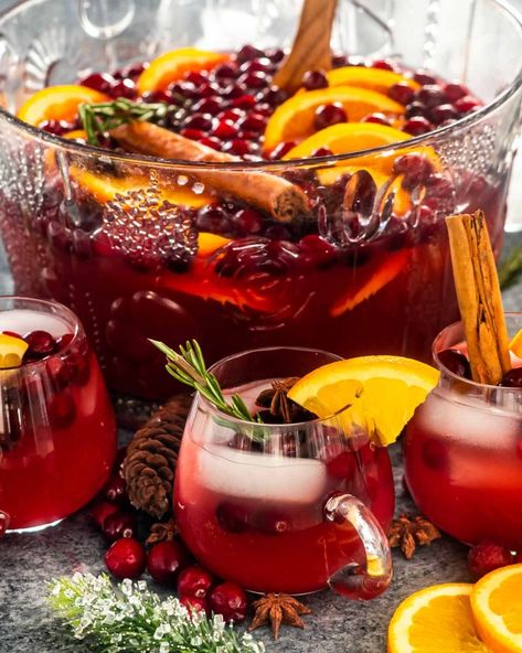 Christmas Sangria Punch Bowl, Spiced Christmas Punch, Christmas Ornament Drinks For Adults, Christmas Drinks With Alcohol, Holiday Spiked Punch, Batched Christmas Cocktails, Holiday Mocktail Punch, Holiday Party Food Ideas Christmas, Christmas Eve Hosting