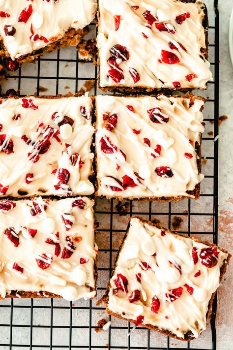 Cranberry Bliss Bars are a copycat version of the bars you find at Starbucks. These bars are festive, sweet and the perfect holiday treat. The bars mix together white chocolate with dried cranberries and are topped with a cream cheese frosting. These would be great in holiday gift tins too! // acedarspoon.com #bars #dessert #cranberry #blissbars #starbucks Almond Energy Bites, Cranberry Almond Energy Bites, Cranberry Bliss Bars Starbucks, Bliss Bars, Cranberry Bliss, Bliss Bar, Cranberry Bars, Cranberry Bliss Bars, Cranberry Cream Cheese