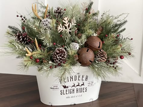 Christmas Tin Bucket Ideas, Rustic Christmas Floral Arrangements, Tin Bucket Christmas Decor, Christmas Floral Arrangements Farmhouse, Porch Pots Christmas Diy, Christmas Centerpieces Diy Rustic, Fake Floral Arrangements Diy, Christmas Porch Pots, Christmas Flower Arrangements Ideas