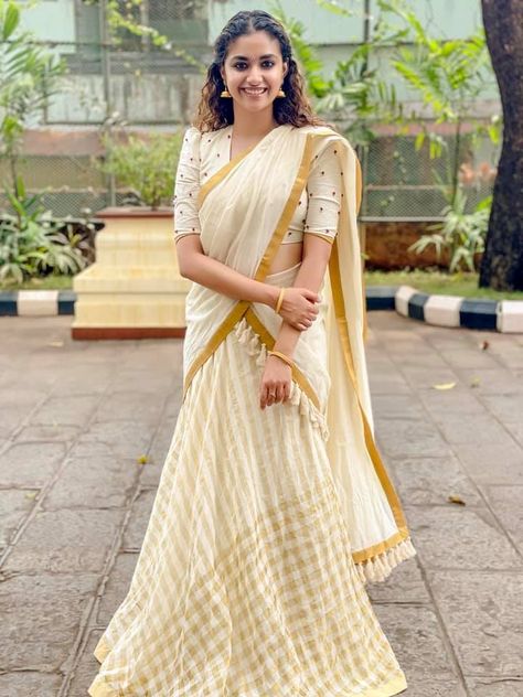 Keerthy Suresh in ivory half saree by poornima indrajith for guruvayur visit 1 Kasavu Half Saree, Onam Dress, Kerala Saree Blouse, Onam Outfits, Kerala Saree Blouse Designs, Onam Saree, Long Skirt And Top, Saree Hairstyles, Keerthy Suresh