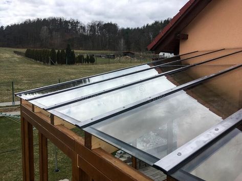 The detail of the transparent glass roof of the wooden pergola. royalty free stock photography Glass Pergola Roofs, Glass Roof Detail, Glass Pergola, Transparent Roof, Wood Canopy, House Image, Wooden Pergola, The Modern House, Pergola With Roof