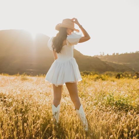 Coastal cowgirl reporting for duty 🤠🤍 This shoot has quickly become my best performing Pinterest post & truly, im so awful at remembering to do any posting on Pinterest that I hadnt even realised until last week that so many people had seen this on there. Anyways, it’s also still one of my personal favorite moments with @micarodriguezphoto and I think that deserves a repost ✨ . . #coastalcowgirl #cowgirlstyle #cowgirlboots #stagecoach #westernstyle #countryfashion #coastalcowgirlaesthetic ... Fashion Shoot Outfits, White Cowgirl Boots Photoshoot, Country Dress Photoshoot, Cowgirl Outfit Photoshoot, Cowgirl Birthday Pictures, Country Inspired Photoshoot, Cowgirl Inspo Pics, Western Girl Photoshoots, Picture Ideas In A Dress