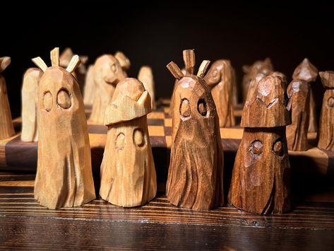 Chess set #2 complete. The light pieces are basswood and the dark are butternut. No sanding or painting, so you’ll see all the grains, knots, worm holes, flaws, imperfections and all. . . . #whittling #woodcarving #woodcraft #ghostcollector #halloween #halloweendecor #chess #chessset Whittled Chess Pieces, Carving Chess Pieces, Wooden People, Chess Pieces, Whittling, Chess Set, Hands On Activities, Sanding, Wood Carving