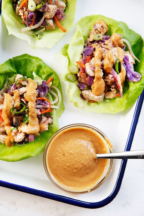 With bold flavor and super fresh ingredients, these Whole30 Thai Chicken Lettuce Wraps are perfect for meal prep for lunch or for a flavorful dinner. Sauce For Lettuce Wraps, Lettuce Wrap Sauce, Thai Chicken Lettuce Wraps, Lexi's Clean Kitchen, Thai Peanut Chicken, Peanut Chicken, Grape Salad, Chicken Lettuce Wraps, Thai Chicken