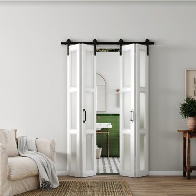 The 3 lite frosted glass folding door boasts a captivating combination of flexibility and transparency. Its unique design allows it to effortlessly fold away, creating an open and spacious environment when desired. The frosted glass panels provide a sense of privacy, delicately diffusing light while still allowing glimpses of the outside world. Its translucent texture adds a subtle touch of style, transcending the boundaries between contemporary and classic designs. | Barn Door - CHIC MODE 48“ * Acordian Doors Modern, Acordian Doors, Bifold Interior Doors, Dining Room Door, Rental Renovation, Glass Bifold Doors, Bypass Barn Door, Sliding Folding Doors, Bifold Barn Doors