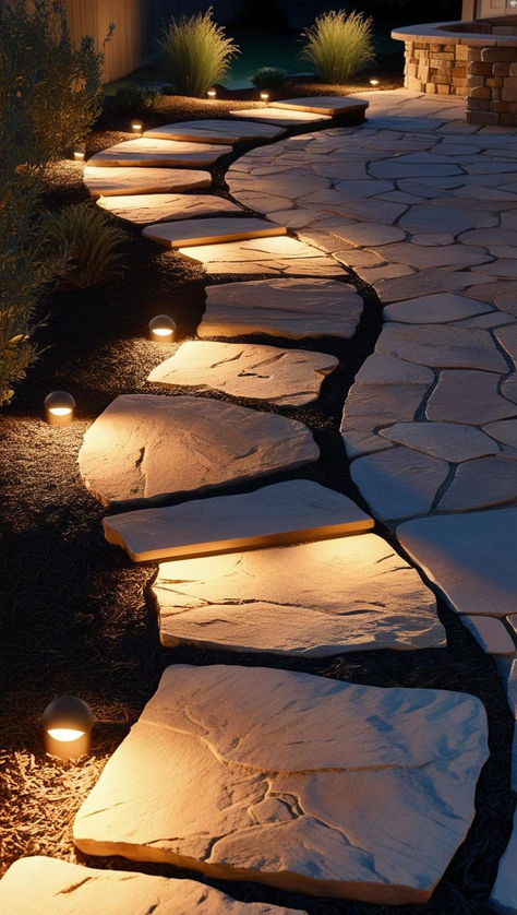 A beautifully designed stone walkway leading to a cozy front yard, surrounded by lush greenery and pathway lights. Side Walkway Ideas, Outdoor Path Lighting Walkways, Walk Ways To Front Door Pathways, Side Walkway Ideas Pathways, Path Lighting Walkways, Walkway Design Ideas, Brick Paths, Side Walkway, Diy Pathway