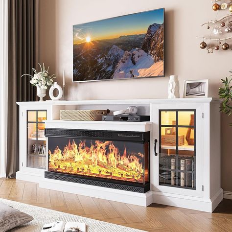 PRICES MAY VARY. 3-Side Glass Display Fireplace: 24 inch fireplace featuring 5 settings for flame brightness, 12 colors of backlight and 12 LED colors of light strips, Besides, it allows you to adjust the temperature from 65°F to 95°F and the time setting is from 0 to 6 hours Attractive Farmhouse Style: Featuring a combination of rustic and modern elements, the TV stand incorporates farmhouse glass doors that add a touch of elegance and provide a glimpse of the contents inside Sturdiness and Dur Hidden Game Console, Tv Table White, Display Fireplace, Tv Console With Fireplace, Farmhouse Glass Door, 3 Sided Fireplace, Media Entertainment Center, Tv Entertainment Centers, Tv Stand Decor