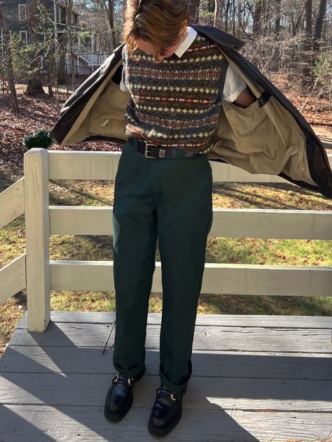 masculine person wearing a sweater vest and dark green dickies pants and black loafers Masculine Sweater Outfit, Academia Outfits Masculine, Queer Preppy Style, Goblin Core Fashion Men, Fem Masculine Outfits Men, Cottagecore Outfits Masculine, Cottage Core Outfits Masc, Soft Academia Aesthetic Outfits Men, Autumn Masc Outfits