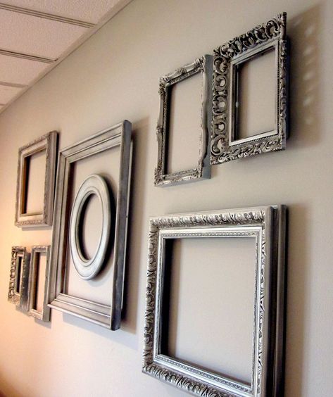 Add interest to a big blank wall with spray painted thrift store frames!  Layer them for additional interest.  http://christinasadventures.com/2012/04/empty-frame-wall-bedroom-dcor.html Silver Frames On Wall, Wall Pinning, Wall Pinterest, Chalkboard Walls, Empty Picture Frames, Big Blank Wall, Empty Frames, Old Picture Frames, Wall Frames