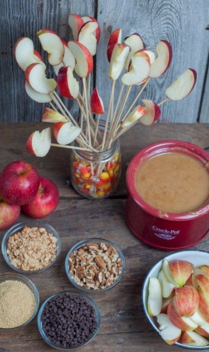 Caramel Apple Dip, serve warm with apple slices from Farmwife Feeds #recipe #crockpot #apples Caramel In Crockpot For Caramel Apples, Carmel Apple Slices Bar, Halloween Carmel Apples Slices, Halloween Party Caramel Apple Bar, Hot Caramel Dip For Apples, Apple Dip Station, Apple Slice Dipping Bar, Apple Dip Charcuterie Board, Taffy Apple Bar