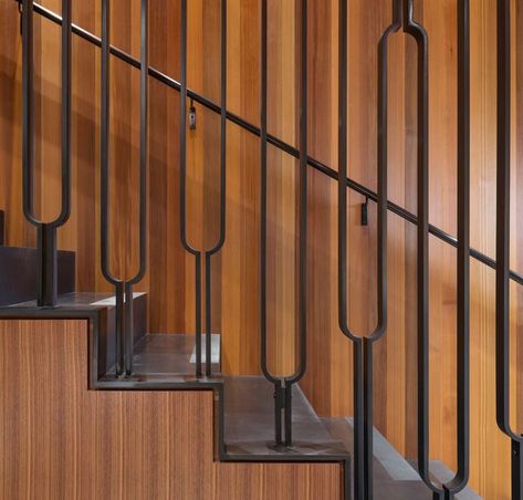 This modern black steel balustrade has a u-shaped design, adding an artistic touch to the home. #Stairs #StairDesign #SteelStairs #Handrail #SteelHandrail Bachelor House, Stairs Steel, Steel Stair Railing, Metal Stair Railing, درج السلم, Steel Railing Design, Steel Balustrade, Seattle Waterfront, Handrail Design