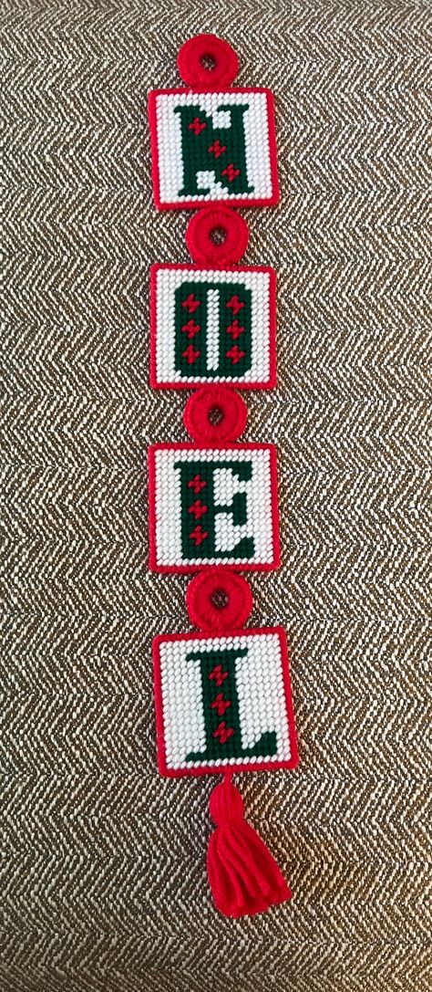 "These are great on a tree, wreath or hanging on a door. Granny retro!  A vintage handmade wall hanging that spells NOEL. It is plastic canvas squares with completed needlepoint. Each square has a green letter on a white background with a red border There is a needlepoint \"tassel\" at the end and a needlepoint hook for hanging. The back of each square is covered with white felt material.  The entire piece is 20 inches long and it is 3 inches wide.  This item is in very good condition, no loose Plastic Canvas Stocking Patterns, Plastic Canvas Christmas Patterns, Plastic Canvas Wreath, Plastic Canvas Candle Holders, Needlepoint Tree, Plastic Canvas Candle, Plastic Canvas Letters, Needlepoint Christmas Ornaments, Plastic Canvas Ornaments