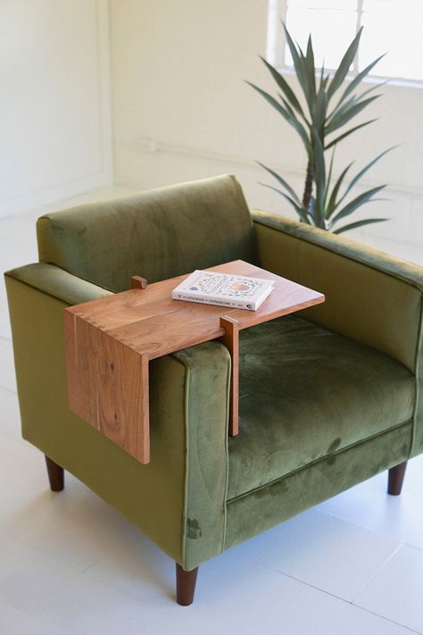 Solid Acacia Wood Adjustable Arm Table. This unusual table can be used on the arm of a chair or as an adjustable display riser. This is made of acacia wood. Angular and sturdy, this riser was made in India and features dovetail joints. In one image, the riser is shown on top of our adjustable acacia wood coffee table, which is sold separately (NRAH1044). Each sold separately. Please note since the table is not attached to the arm, one must take care to maintain balance. Matching pieces sold sepa Reading Chair Table, Wooden Arm Rest For Couch, Bedroom Arm Chair Ideas, Chair Arm Table, Living Room Card Table, Slim Coffee Table, Sofa With Table Attached, Cool Furniture Design, Chair With Table Attached