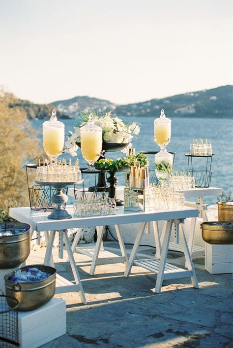 The Best Ways to Keep Guests Hydrated at Your Wedding Mykonos Themed Party, Greek Wedding Food, Lime Infused Water, Greece Party, Lemonade Bar, Wedding Drink Station, Mykonos Wedding, Wedding Food Drink, Project Theme