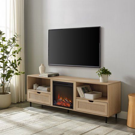 Introduce an inviting and cozy vibe to your home with the Manor Park 70 Bohemian Wood and Rattan Electric Fireplace TV Stand. This stylish TV stand features an electric fireplace unit that allows you to control the flames and heat separately with the switch of a button. The beautiful rattan detailing and natural wood finish give this piece an earthy and bohemian aesthetic, while the two drawers and two open cubbies provide plenty of storage for all your living room essentials. Use the cord manag Coastal Oak, Rattan Door, Cane Door, Tv Stand Brown, Electric Fireplace Tv, Tv Stand Decor, Electric Fireplace Tv Stand, Living Room Essentials, Fireplace Insert