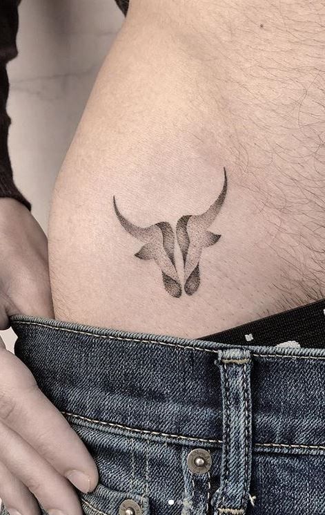 Small Taurus Tattoo For Guys, Back Tattoo Taurus, Taurus Symbol Tattoo Men, Taurus And Scorpio Tattoo Together, Bull Tattoo Feminine Taurus, Ox Tattoo Design, Taurus Back Tattoo, Geometric Tattoo Taurus, Small Bull Tattoos