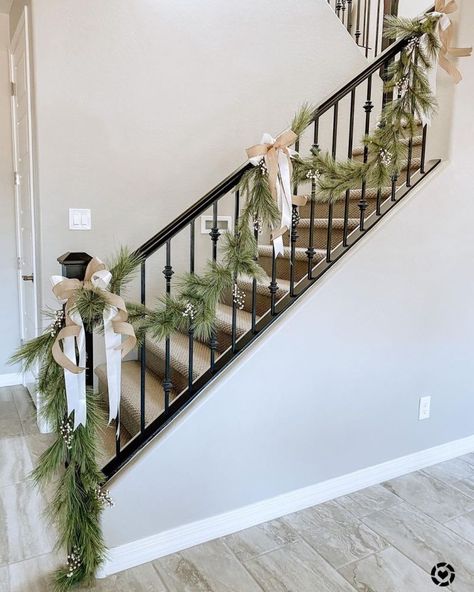 Garland And Stockings On Staircase, Simple Banister Christmas Decor, Spiral Staircase Christmas Decor, Christmas Banister Ideas, Stair Railing Christmas Decorating Ideas, Christmas Bannister Ideas, Banister Decor, Christmas Garland Staircase, Decor Noel