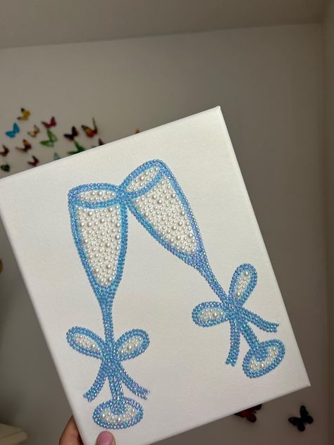 Handmade rhinestone canvas! This canvas is an 8x10.  Made to order! Two champagne glasses in a super cute blue color with white pearls! Baddazled Canvas, Printable Diamond Painting Patterns, Canvas Gem Art, Diamond Art Canvas, Bedazzled Painting Ideas, Rhinestone Painting Ideas, Rhinestone Painting Aesthetic, Badazzel Canvas, Gem Painting Ideas