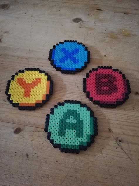 Mini gaming button coasters handmade hama beads x b a y | Etsy Perler Creations Coasters, Game Controller Perler Beads, Melting Beads Coaster, Perler Bead Coasters Circle, Cute Perler Bead Coasters, Circle Perler Bead Patterns Small, Fuse Beads Coasters, Peeler Bead Coaster, Nintendo Perler Beads