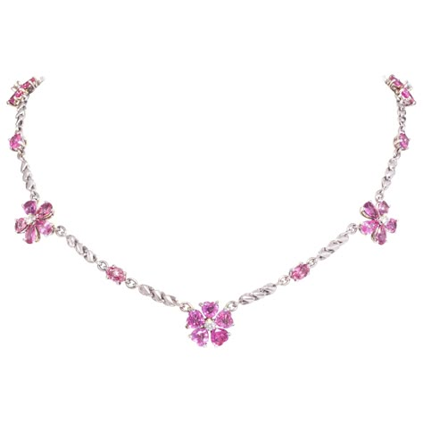 The pink sapphire and diamond necklace features 5 flowers with drop, oval and heart shaped sapphires of lovely color crystalline texture for a total weight of 16.90 carats. The design is complete with 0.49 carats of round diamonds of top quality (F/G-VVS). The necklace is one-of-a-kind. It was handmade in Italy in our own workshop by maestro Scalabrì according to an original design by Ella Gafter. The item is signed EG. Sibling Challenge, Pink Diamond Necklace, Pink Sapphire Necklace, Sapphire Diamond Necklace, Pink Gemstone Necklace, Pink Items, Choker Necklace Designs, Necklace With Diamonds, Barbie Wardrobe