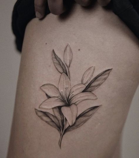 Realism Lily Tattoo, Black And Grey Lily Tattoo, Lily Tattoo On Thigh, Daylillies Tattoos, Stargazing Lily Tattoo, Single Lily Tattoo, Lily Arm Tattoo For Women, Lily Tattoo Thigh, Black And White Lily Tattoo