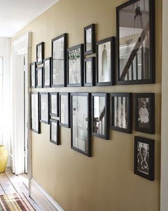 How To Hang Pictures In Your Home's Hallway Farmhouse Flip, Hallway Gallery, Vstupná Hala, Stair Walls, Family Pictures On Wall, Koti Diy, Photo Wall Display, Hall Ideas, Wall Cover