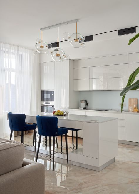 White Glossy Flat-Panel Cabinets with Light Beige Floor Tiles
This kitchen boasts a bright and airy design with its glossy white flat-panel cabinets and white slab backsplash providing a sleek and modern look. Kitchen Beige Floor, Kitchen Curtain Ideas, Kitchen Curtain Designs, Beige Floor Tile, Slab Backsplash, Beige Kitchen Cabinets, Beige Floor, White Subway Tile Backsplash, Black Countertops