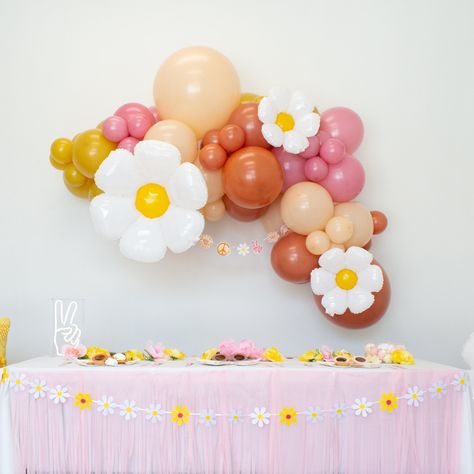 Good vibes only with this groovy balloon garland. These beautiful colors will make a far-out statement for your upcoming Groovy One or Two Groovy birthday party, spring bridal shower, baby shower, and more. Balloon colors include dusty rose, mustard, burnt orange, and blush. Everything you need to set up the garland is included: balloons, balloon tape, and glue dots. You can also opt to add a balloon pump (highly recommended). Complete your retro look with one of our fun tableware collections an Groovy Balloon Arch, Groovy Icons, Two Groovy Birthday Party, Two Groovy Birthday, String Balloons, Groovy Birthday Party, Balloon Colors, Groovy One, Two Groovy