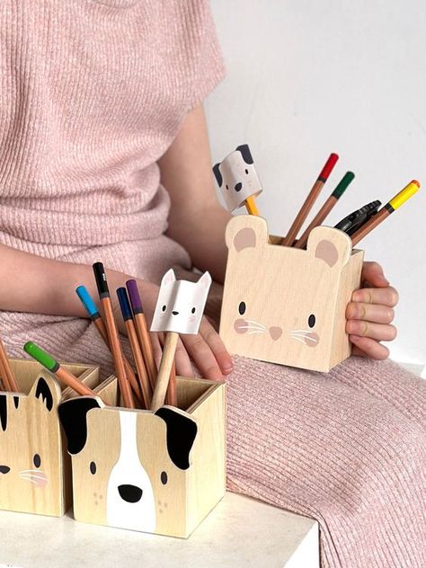 Pet Themed Pencil Holders by Tender Leaf Toys A set of wooden pencil pots to use as organisers for your child creative or work space. Illustrated with a friendly Cat, Dog and Mouse faces. Great along side our Desk and Chair, and a lovely characteristic addition to the nursery. Presented in an illustrated colour box Suitable for ages 3+ Product dimensions: 26.6 x 8 x 10 cms Click on the link below for a free crafty activity! Wooden Pencil Holder, Wooden Toys For Kids, Wood Pencil Holder, Making Wooden Toys, Pencil Holders, Wood Projects For Beginners, Desk And Chair, Wooden Pencil, Wooden Dog