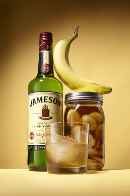 Place bananas and Jameson into a sealed container for three to four days. Strain out banana slices using a mesh strainer and discard. The infusion should be slightly viscous and cloudy—this gives the drink its unique texture, body and flavor. Pour infused Jameson back into container or bottle. Serve in a rocks glass with a single cube. Jameson Whiskey, Jameson Irish Whiskey, Boozy Desserts, Whiskey Drinks, Banana Slice, Jar Gifts, Party Drinks, Cocktail Drinks, Mixed Drinks