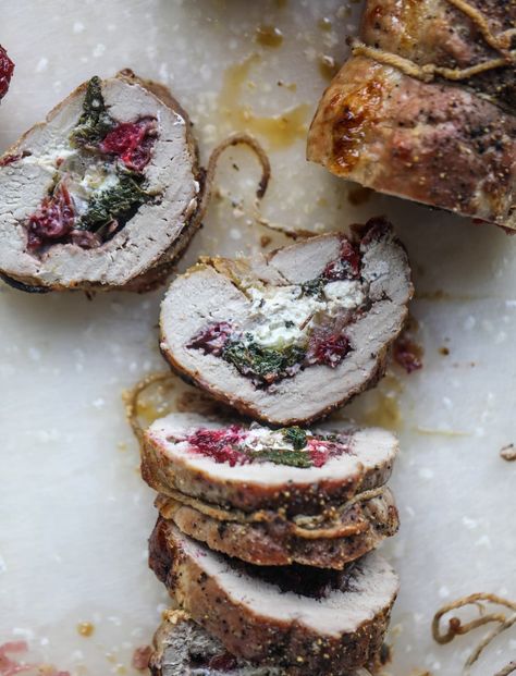 This holiday stuffed pork tenderloin is filled with caramelized onion, fresh cranberry sauce, goat cheese and fresh spinach. It's a show stopped and super delicious, along with being fairly simple to make! I howsweeteats.com #stuffed #porktenderloin Stuffed Pork Loin Recipes, Christmas Pork, Stuffed Pork Loin, Fresh Cranberry Sauce, Cooking Pork Tenderloin, Slow Cooked Pulled Pork, Pork Tenderloin Recipe, Tenderloin Recipe, Stuffed Pork