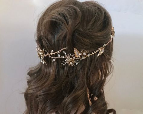 "This amazing floral crystal headpiece is a long flexible vine that can be worn a number of ways. You can drape it loosely around a half to full updo or weave it intricately around a braid to add some romantic detailing to your hairstyle. Gold leaves, sparkling crystals & tiny champagne pearls are woven together to creat a atunning and unique wedding hair accessory. NOTE: On my screen looks like some brown rimming center of flower. This is a shadow, no brown color. READY TO SHIP DETAILS * Ex Gold Head Piece Wedding, Unique Wedding Hair, Full Updo, Pearl Wedding Headband, Story Names, Pearl Headpiece Wedding, Pearl Headband Wedding, Gold Headpiece Wedding, Floral Hair Vine