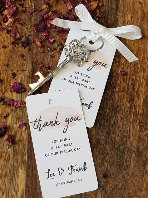 Calligraphy Wedding Favour Keys The price is for 1 key, tag and ribbon If you need any other colour, please enquire first and then choose the custom option. These favours make a lovely gift and keepsake for your wedding guests. Often favours get left on the tables. Why not wow your guests with something they will pick up and keep! These skeleton keys are handy, useful bottle openers! The tag is personalised with the bride and grooms names and also the date of the wedding. The key measures 7.5cm long and the tag is 9cm long They sit really neatly on your guests place setting and are a lovely personalised thank you favour. The tags are white cardstock - the cardstock is high quality 270 gsm Tied with twine or ribbon colour of your choice - please let me know this option Thhe price is for 1 k Cheap Wedding Favours Unique, Key Wedding Favors, Personalised Wedding Favours, Wedding Quote, Key Bottle Opener, Love Decorations, Skeleton Keys, Keys Wedding, Vintage Key