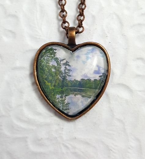 All items made to order! Matching jewelry pieces available! Free Domestic Shipping! This landscape necklace features a bezel, a cabochon, jump rings, a lobster clasp, a rolo chain, and an image from my photography portfolio. The necklace was created by using my photography glazed onto glass.  I took the photo while visiting Kraemer Bayou, Louisiana. Chain: 21 inches long and 2.62mm thick Chains can be cut to the size of your choice, please message any requests.   Necklaces with silver pendants a Jewelry Glass, Heart Pendants, Photo Necklace, Matching Jewelry, Funky Jewelry, Oval Pendant, Rolo Chain, Silver Pendants, Dream Jewelry