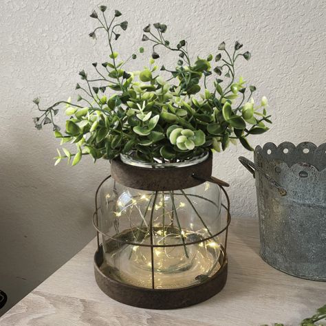 PRICES MAY VARY. 【Adorable Farmhouse Decor】This is a vintage styled glass vase with 4 Pcs greenery, also a beautiful accent jar lantern with removable florals, so this piece can be used throughout the year. Perfect for home decor and floral arrangements 【Versatile Function】Rustic vase with lush greenery works with your unique decorating style! Fits in perfectly with most any home decor style, Farmhouse, Rustic, Lakeside, Industrial or Boho chic in your Bedroom, living room, kitchen or dining roo Rustic Lantern Decor, Decor With Plants, Vase Rustic, Glass Farmhouse, Country Western Decor, Home Decor Floral Arrangements, Farmhouse Lantern, Farmhouse Vase, Lantern Decor