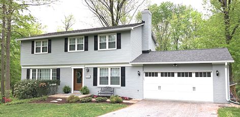 The after of a two-story colonial home with an updated exterior. Update Colonial House Exterior, Updated Colonial Exterior, Colonial House Exterior Makeover, Colonial Exterior Makeover, Colonial Exterior Remodel, Colonial Curb Appeal, Modern Colonial Exterior, Colonial Remodel, Painted Brick Exteriors