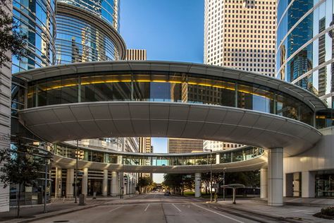 Skybridge is a type of pedway consisting of an enclosed or covered bridge between two buildings. This protects pedestrians from the weather. However, with the development of architecture and construction in the past few decades, the look and purpose of the sky bridges are to some extent changed. So today we can see that in addition to the basic functions it perform, these unusual constructions serve, also, as a observation platforms, luxury hospitality facilities,works of art... Circle Building Architecture, Circle Building, Bridges Architecture, Luxury Hospitality, Sky Bridge, Commercial And Office Architecture, Arch Bridge, Bridge Building, Building Architecture