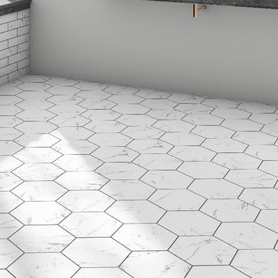 Meant to capture the appearance of marble, these tiles offers this timeless look in a durable, easy to maintain option. This hexagon shaped tile is perfect for any setting traditional enough for historical renovations or modern enough for new construction. It is available in forty-seven print variations that are randomly scattered throughout each case. This tile is durable and safe for heavy-duty interior and exterior locations including industrial applications. Tile is the better choice for you Patterned Wall, Historic Renovation, Floor Tile Design, Ceramic Subway Tile, Merola Tile, Porcelain Mosaic Tile, Marble Mosaic Tiles, Hexagon Tiles, Natural Stone Tile