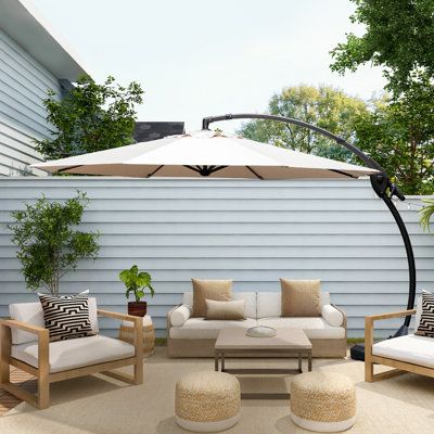 The entire patio offset umbrella frame is constructed of rust-free aluminum, from the sturdy aluminum pole to the 8 umbrella ribs. The canopy is also designed to last - it is made from water and fade-resistant polyester fabric that is UV-protected and double-coated with polyurethane for added durability. The umbrella for the pool base is included and has hidden wheels to make it easy to move around to your favorite spot. The base must be filled with either sand or water for stability and safe us Backyard Umbrella Ideas, Pool Furniture Ideas Decor, Patio Umbrella Ideas, Backyard Umbrella, Mid Century Modern Backyard, Fence Plant, Pool Umbrella, Deck Umbrella, Umbrella Patio