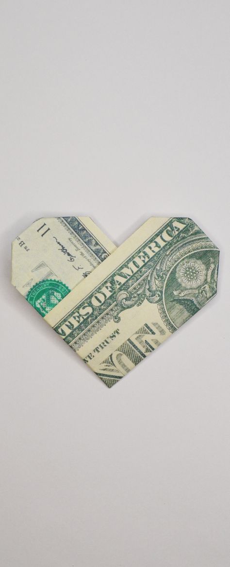 The money heart is an easy origami out of one dollar bill. Without using glue or tape. It's a nice gift for Valentine's day! Do you like this origami? I wish you a pleasant viewing! Subscribe to my channel! Paper Hearts Origami Aesthetic, Origami Heart From Dollar Bill, Dollar Bill Heart How To Make, Money Origami Easy Numbers, Gifts Made Out Of Money Dollar Bills, Orgamini Money, Money Heart Origami How To Make, Money Heart Aesthetic, 5 Dollar Bill Origami