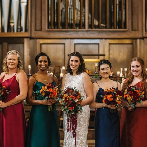 Moody jewel-tone dresses & richly colored bridal bouquets to match! We're still swooning over these vibrant arrangements we created for a wedding at the Wightman Chapel Jewel Tone Wedding Party Groomsmen, Gem Tones Wedding, Jewel Tone Bridesmaid, Jewel Tone Wedding Flowers, Jewel Tone Dress, Orange Bridal Bouquet, Wedding Party Groomsmen, Wedding September, Enchanted Florist