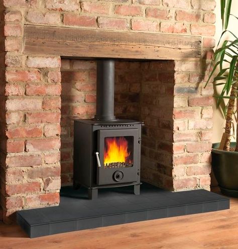 raised hearth Brick Fireplace Log Burner, Wood Stove Surround, Exposed Brick Fireplaces, Woodburning Stove Fireplace, Wood Burner Fireplace, Wood Stove Hearth, Wood Burning Stoves Living Room, Log Burner Fireplace, Log Burner Living Room