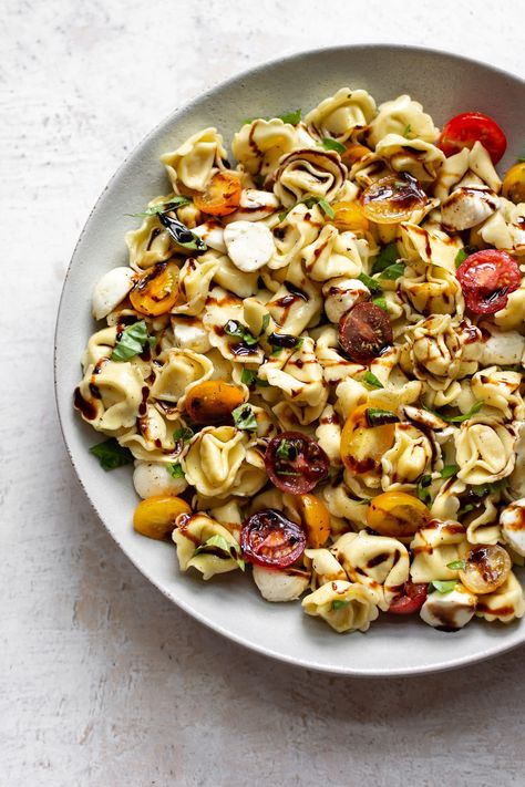 This simple cold tortellini pasta salad has tomatoes, fresh basil, mozzarella balls, and a sweet and tangy balsamic drizzle. The perfect easy summer recipe! Caprese Tortellini, Fried Neckbones, Tortellini Pasta Salad Recipes, Tortellini Pasta Salad, Salad Making, Salt Lavender, Salad With Balsamic Dressing, Spinach Tortellini, Pasta Salad With Tortellini