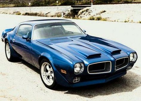 The 1970 Pontiac Firebird Formula 400 hardtop coupe was powered by a 400 cid four-barrel V8 engine developing 265 horsepower. The engine was linked to a Hurst three-speed floor shifter with F70-14 bias-belted blackwall tires and seven-inch wheel rims at all four corners. They had upgraded suspension, front disc and rear drum brakes, vinyl interiors, bucket type seats, concealed wipers, deluxe steering wheel, and dual outside sport mirrors. Exterior visual design cues included twin hood scoops. Pontiac Firebird Formula, Firebird Formula, Tracked Vehicles, Car Man Cave, Lifted Ford, Pontiac Trans Am, K5 Blazer, Pontiac Firebird Trans Am, Vintage Muscle Cars