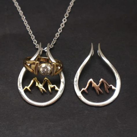 Are you looking Ring Holder Necklace? We introduce our Mountain Themes Ring Holder Necklace made especially for mountaineers and climbers. Can you imagine how painful can be when you lost your wedding ring in the middle on the mountain? Instead of keeping the ring your pocket or asking your Jewelry Metalsmithing, Lock Charm Necklace, Wedding And Engagement Ring, Shooting Star Necklace, Engagement Ring Necklace, Ring Holder Necklace, Mountain Ring, Ring Holders, Necklace Holder