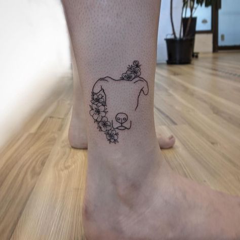 Dog And Flower Tattoo Minimalist, Dog Silhouette Tattoo With Flowers, Dog Outline Flower Tattoo, Pet Flower Tattoo, Dog In Flowers Tattoo, Half Dog Half Flower Tattoo, Fine Line Pet Portrait Tattoo, Fine Line Pitbull Tattoo, Dog Tattoos With Flowers