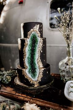 Epic Gilded Gold Black and Emerald Green Geode Wedding Cake!  #weddingcake #cake #wedding #weddingideas #airbus #outdoorwedding #emeraldwedding #geodewedding #macramewedding #colorscheme #weddingtheme #bohowedding #goldwedding #greenwedding #confettidaydreams www.mccormick-weddings.com Virginia Beach Airstream Wedding, Geode Wedding Cake, Geode Cake Wedding, Green Geode, Geode Wedding, Geode Cake, Black Wedding Cakes, Emerald Green Weddings, Dark Wedding