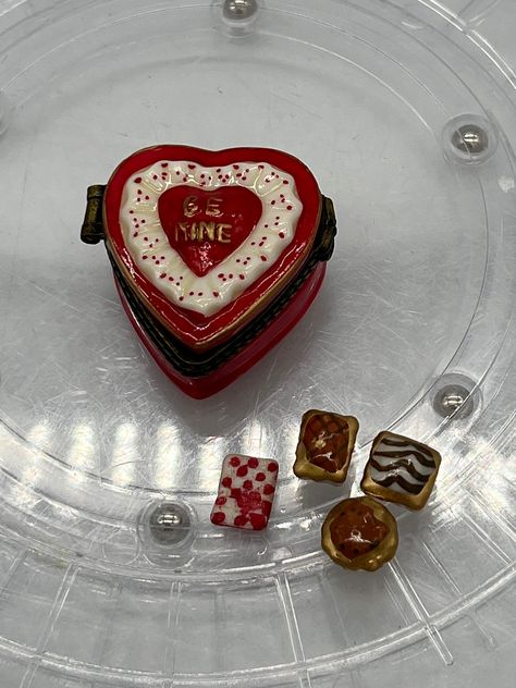 "Gorgeous Valentine's PHB Trinket Box With 3 Chocolate Candy Trinkets and One Trinket that looks like it's supposed to tell you the flavors of the chocolates.  This lovely heart shaped Valentine's candy box with three candy trinkets. It says \"Be Mine.\" On the front. Great gift for your lady and it's calorie free!! Extremely rare to find all 3 candies much less the flavor directions!" Phb Trinket Boxes, Trinket Box Ideas, Phb Trinket, Handmade Trinkets, Heart Shaped Boxes, Candy Box Diy, Heart Jewelry Box, Valentine's Candy, Vintage Trinkets