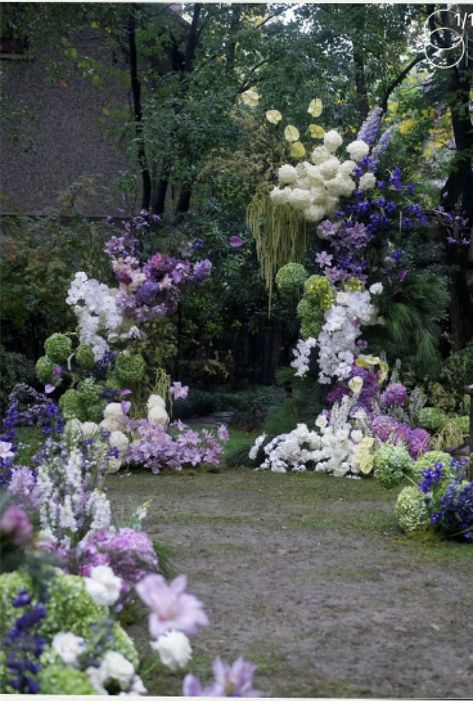 Pink Purple White Green Wedding, Unstructured Floral Arrangements Wedding, Purple Flower Installation, Purple Arch Wedding, Green And Purple Flower Arrangements, Wedding Arch Flowers Purple, Lilac Green Wedding, Wedding Florals Purple, Purple Green And White Wedding