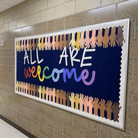 This inclusive bulletin board idea is perfect for a school hallway! Large School Bulletin Board Ideas, Welcome Back To The Library Bulletin Board, We All Belong Bulletin Board, Preschool Hallway Bulletin Boards, Equity And Inclusion Bulletin Board, You Belong Bulletin Board Ideas, School Pride Bulletin Board Ideas, Bulletin Boards For Middle School Hallways, School Spirit Bulletin Boards Elementary